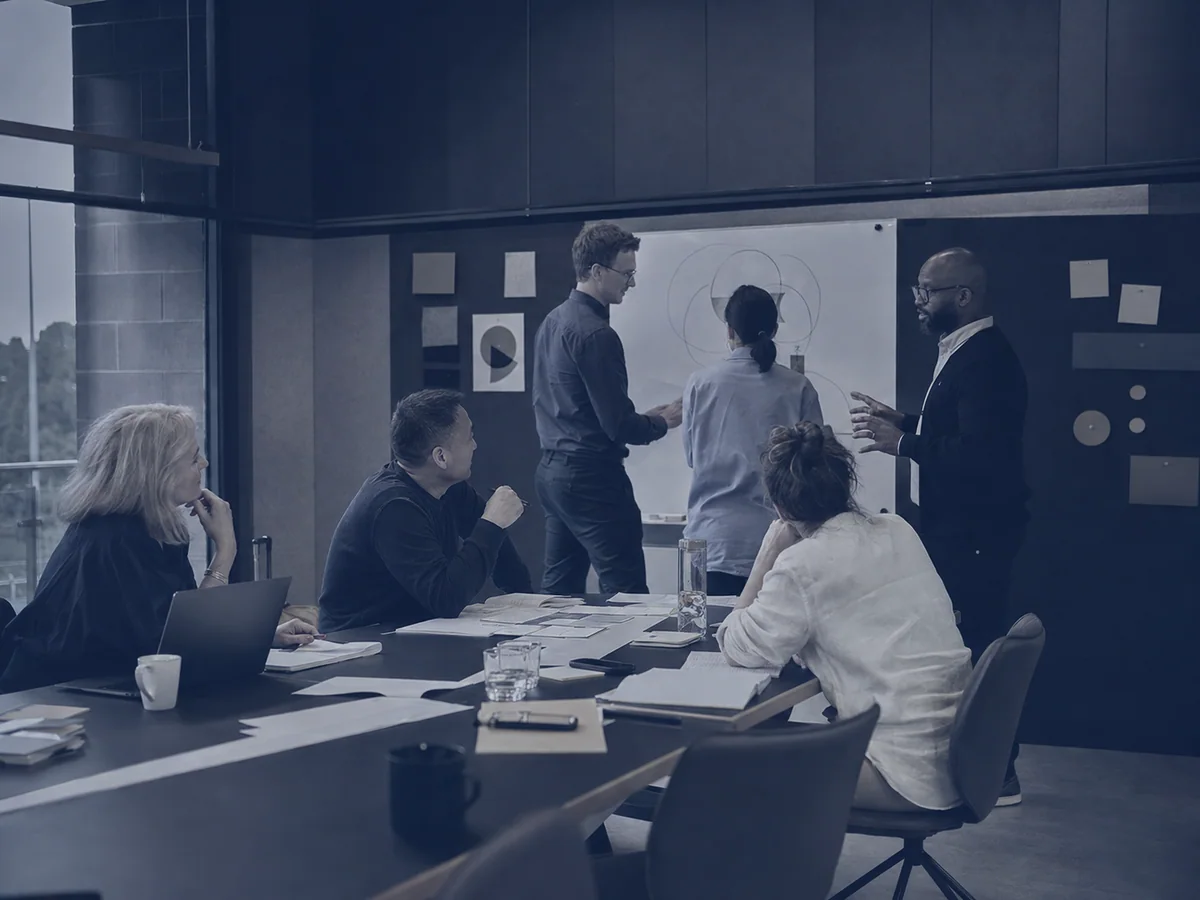 A corporate academy cohort working through a practical challenge